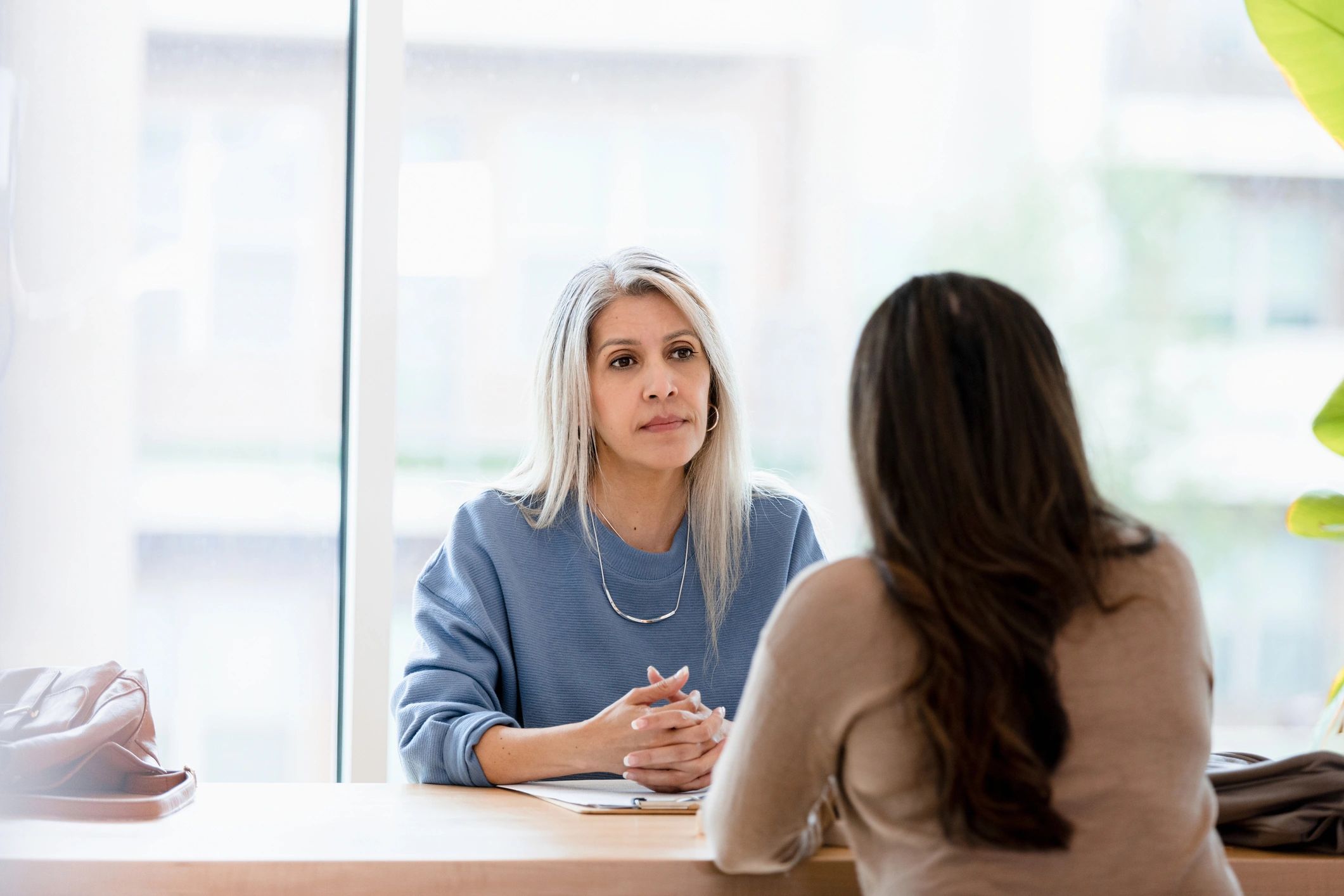 Adult client in a calm one-to-one counselling conversation