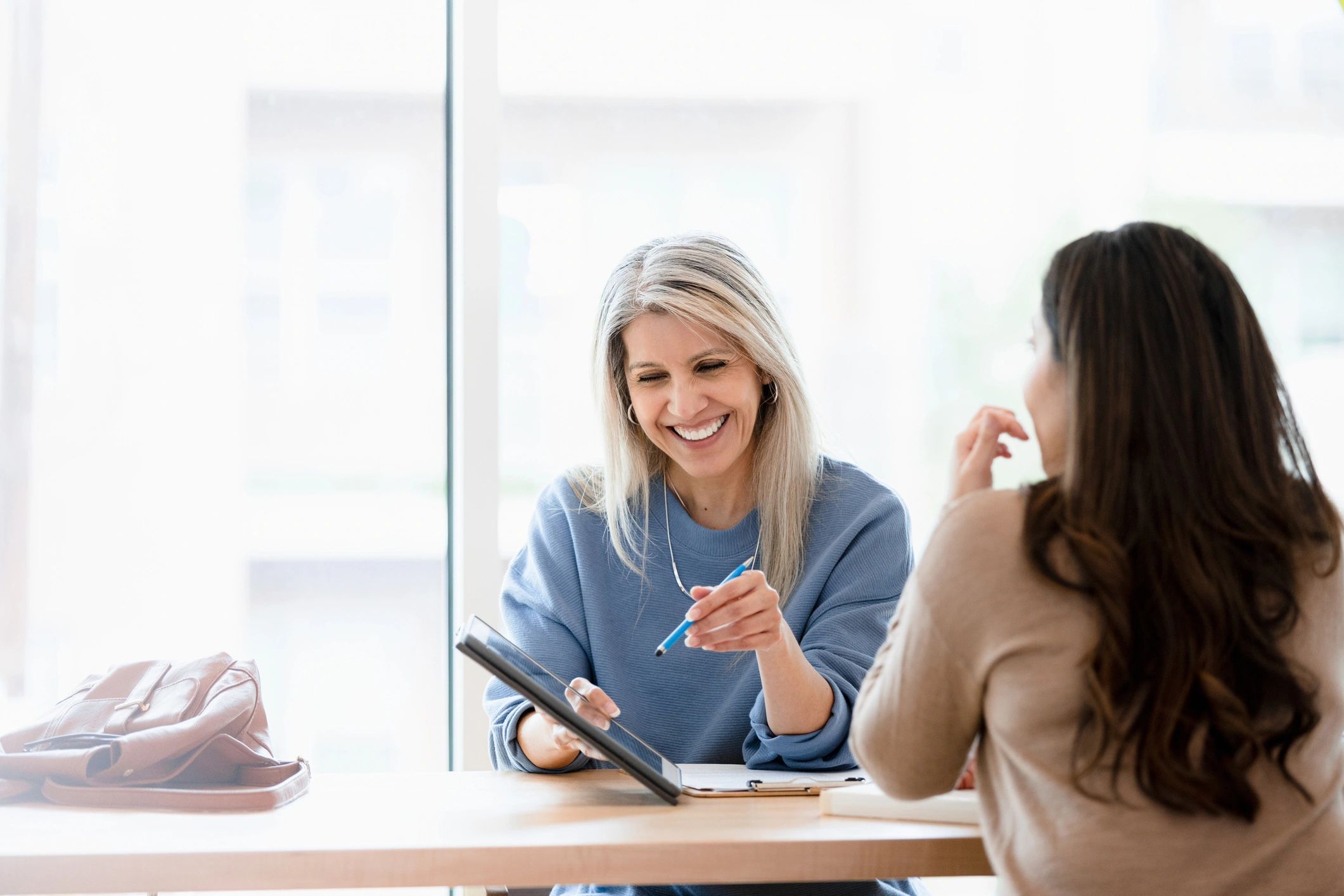 Supportive conversation across a table in a private session